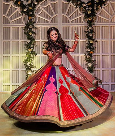 indian bride twirling , sabysachi bride , big fat indian wedding , multi coulured lehenga design , sabysachi lehenga design